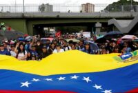 1768129550336-massa-turun-ke-jalan-di-caracas-tuntut-pembebasan-nicolas-maduro-1768097277096_169
